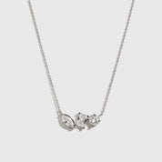 Sterling silver 925 trio-cut dainty necklace with cubic zirconia, shown on a plain background.