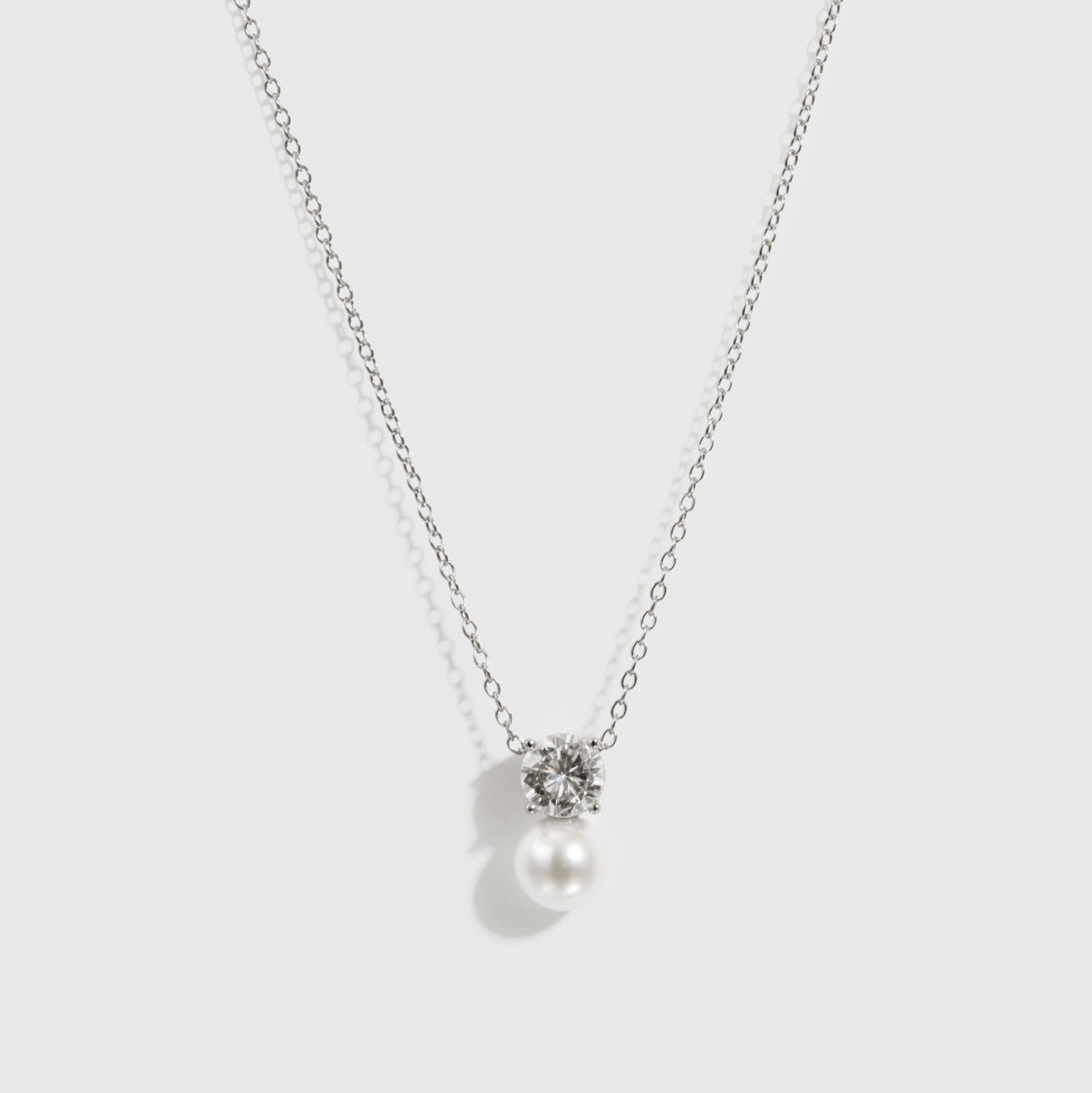 Sterling silver 925 round-cut and glass pearl pendant necklace, shown on a plain background.