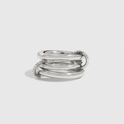 Silver plated quintuplet interlocking pavé links ring with cubic zirconia, shown on a plain background.