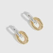 Mixed metal oval link bare pendant hoops, shown on a plain background.