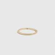 14k solid gold delicate ring, shown on a plain background.