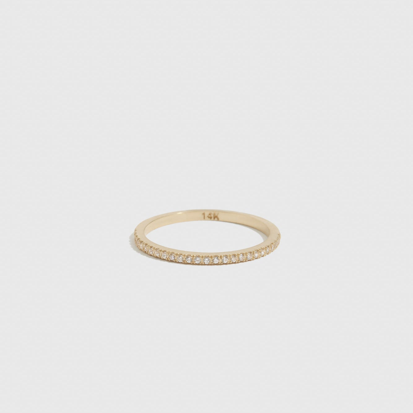 14k solid gold half eternity pavé ring with lab-grown diamonds, shown on a plain background.