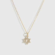 14k solid gold Star of David pavé pendant necklace with cubic zirconia or lab-grown diamonds, shown on a plain background.