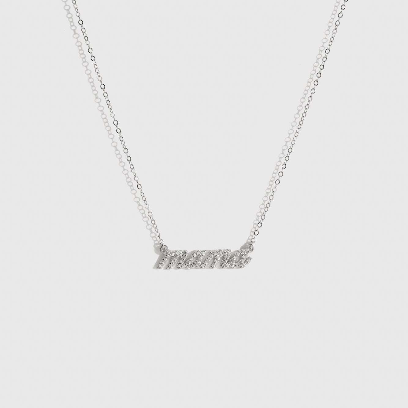 Sterling silver 925 Mama pavé necklace with cubic zirconia, shown on a plain background.