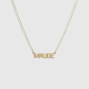 14k solid gold personalized block font nameplate necklace, shown on a plain background.