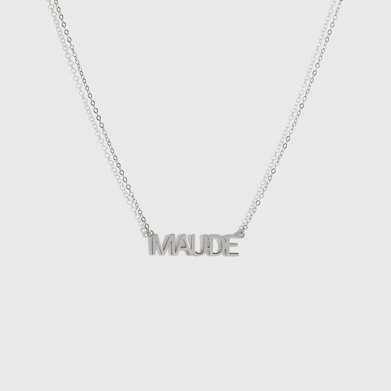 Sterling silver 925 personalized block font nameplate necklace, shown on a plain background.