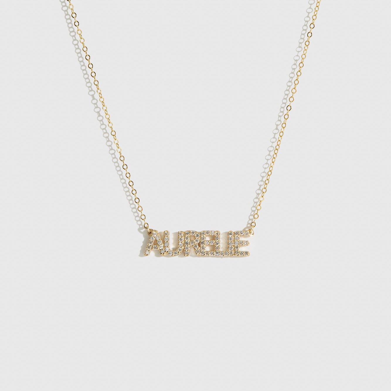 14k solid gold personalized pavé block font nameplate necklace with cubic zirconia or lab-grown diamonds, shown on a plain background.