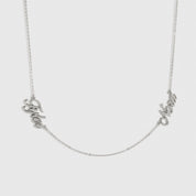 Sterling silver 925 personalized cursive font two nameplates necklace, shown on a plain background.