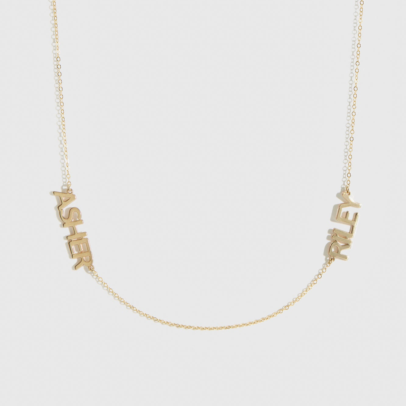 14k solid gold personalized block font two nameplates necklace, shown on a plain background.