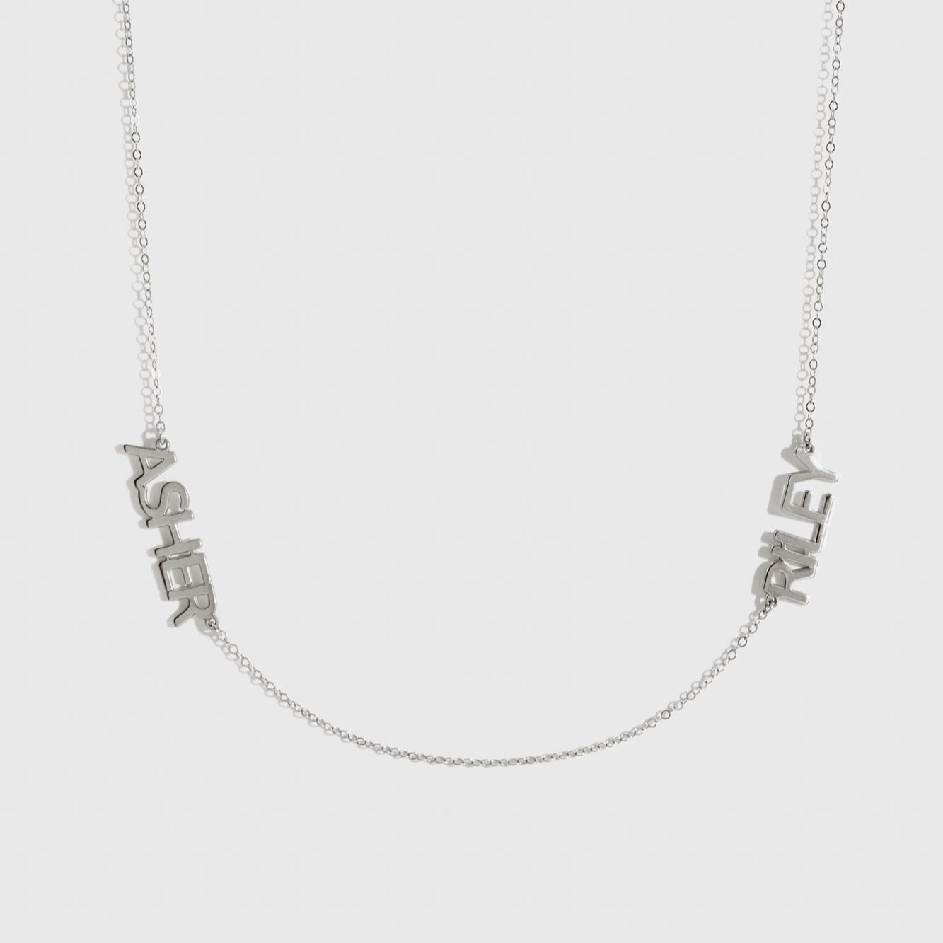Sterling silver 925 personalized block font two nameplates necklace, shown on a plain background.