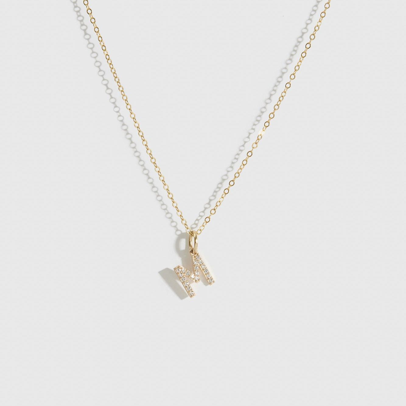 14k solid gold block font pavé letter pendant necklace with cubic zirconia or lab-grown diamonds, shown on a plain background.