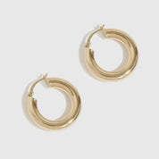 14k solid gold classic tube hoops, shown on a plain background.