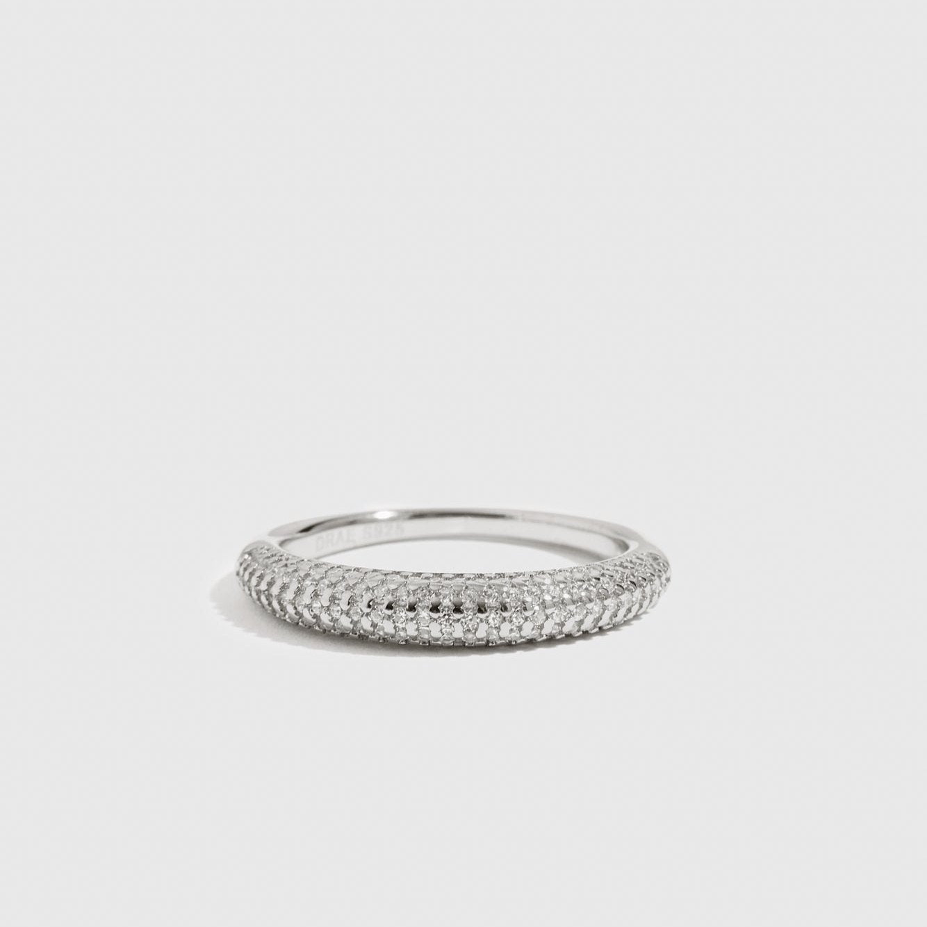 Sterling silver 925 pavé delicate dome ring with cubic zirconia, shown on a plain background.