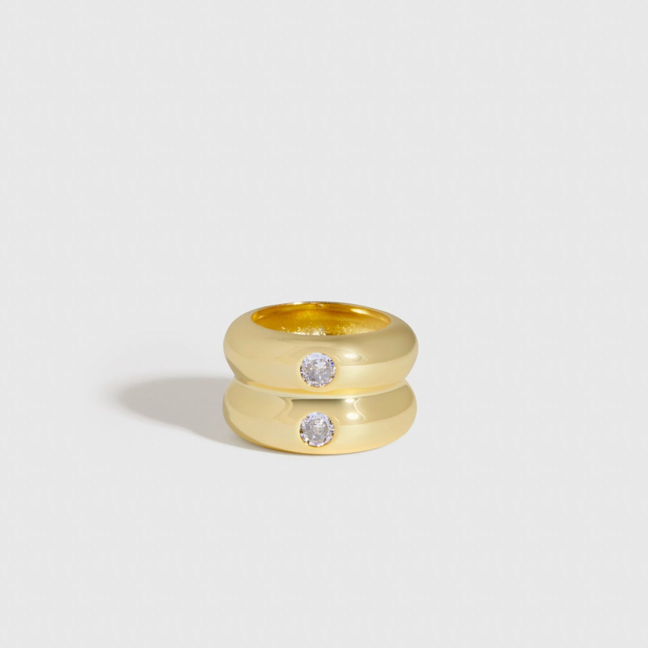 14k gold plated Intuition ring with cubic zirconia, shown on a plain background.