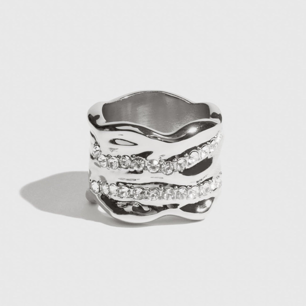Silver plated Bara ring with cubic zirconia, shown on a plain background.