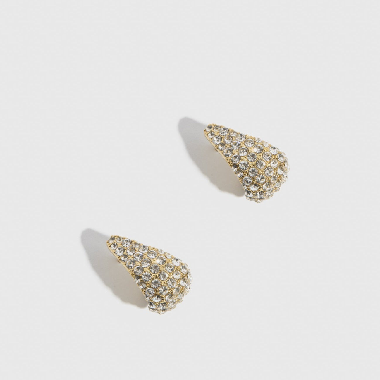 14k gold plated Hira earrings with cubic zirconia, shown on a plain background.