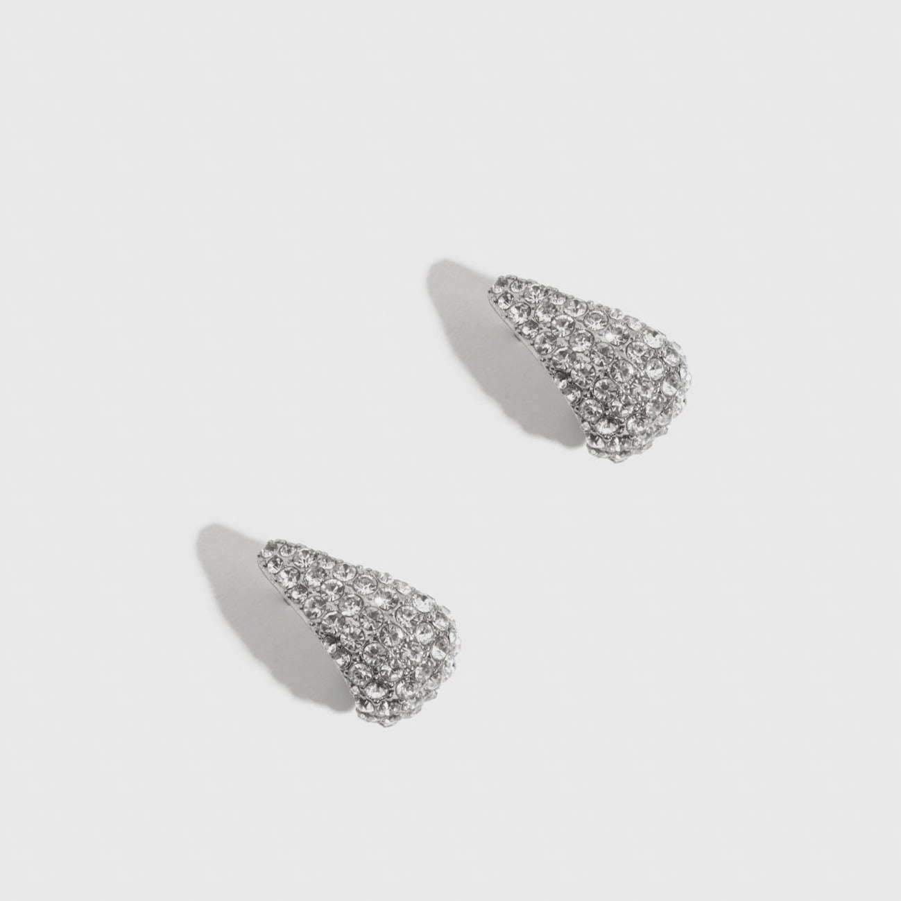 Silver plated Hira earrings with cubic zirconia, shown on a plain background.