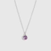 Necklace with a purple gemstone pendant on a white background