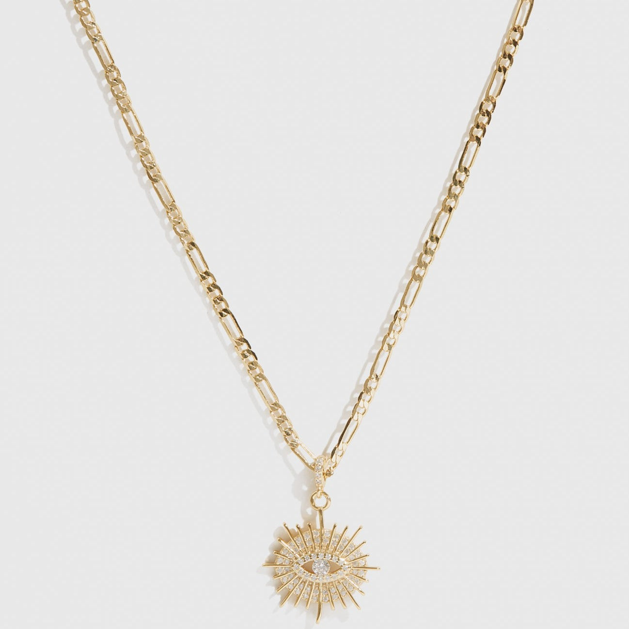 14k gold plated sterling silver 925 Sundaze evil eye necklace with cubic zirconia, shown on a plain background.