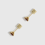 Gold earrings with gemstones on a white background