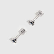 Pair of silver stud earrings on a white background
