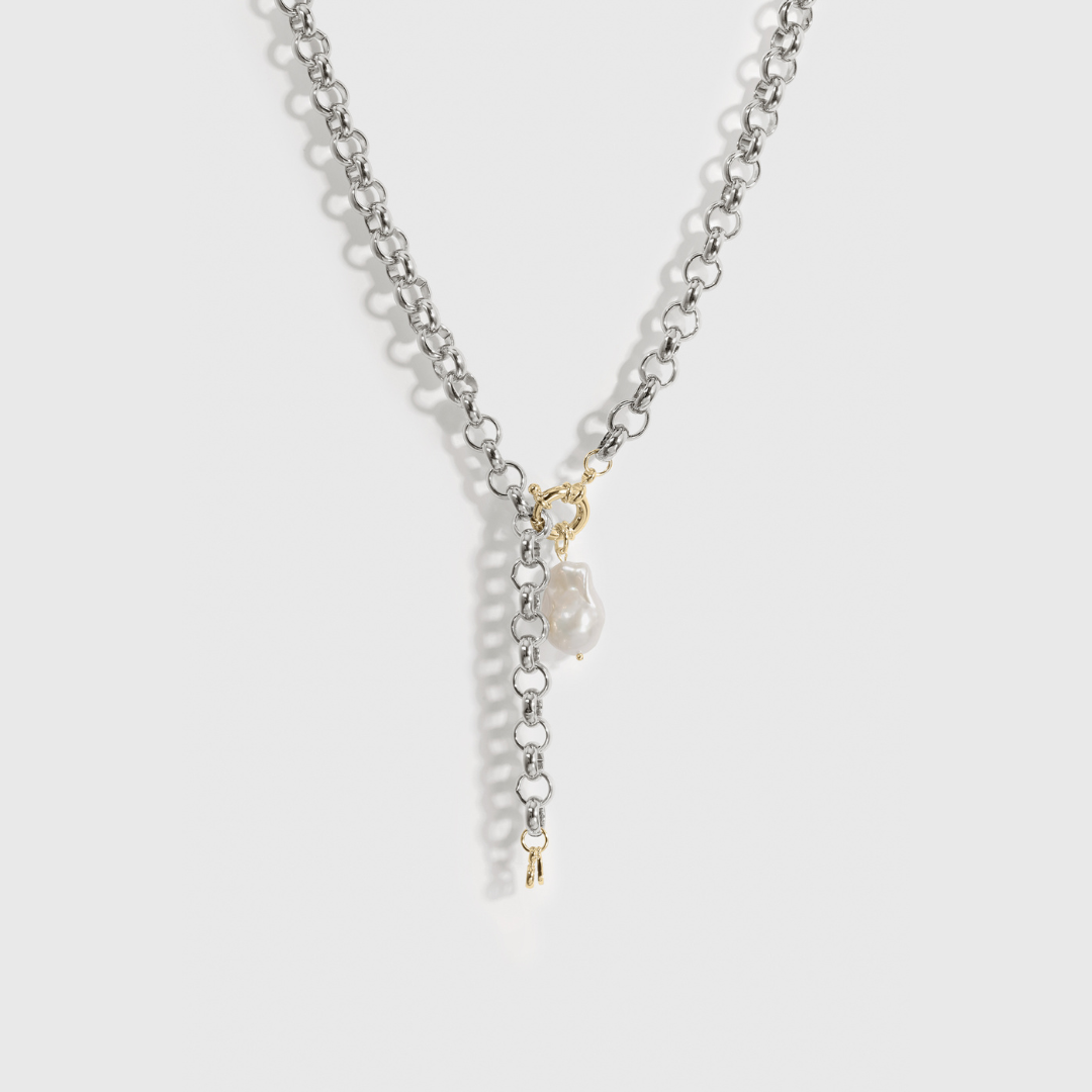 Silver plated N.6 lariat necklace with a baroque freshwater pearl, shown on a plain background.