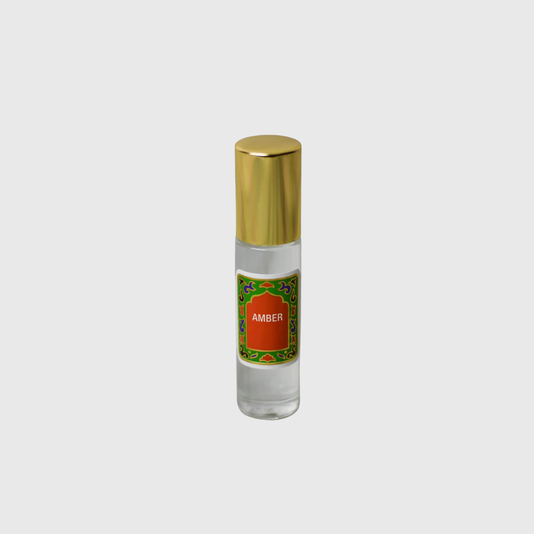 Amber fragrance oil, shown on a plain background.