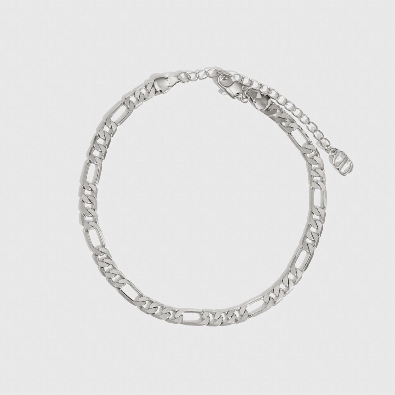 Sterling silver 925 Figaro bracelet, shown on a plain background.