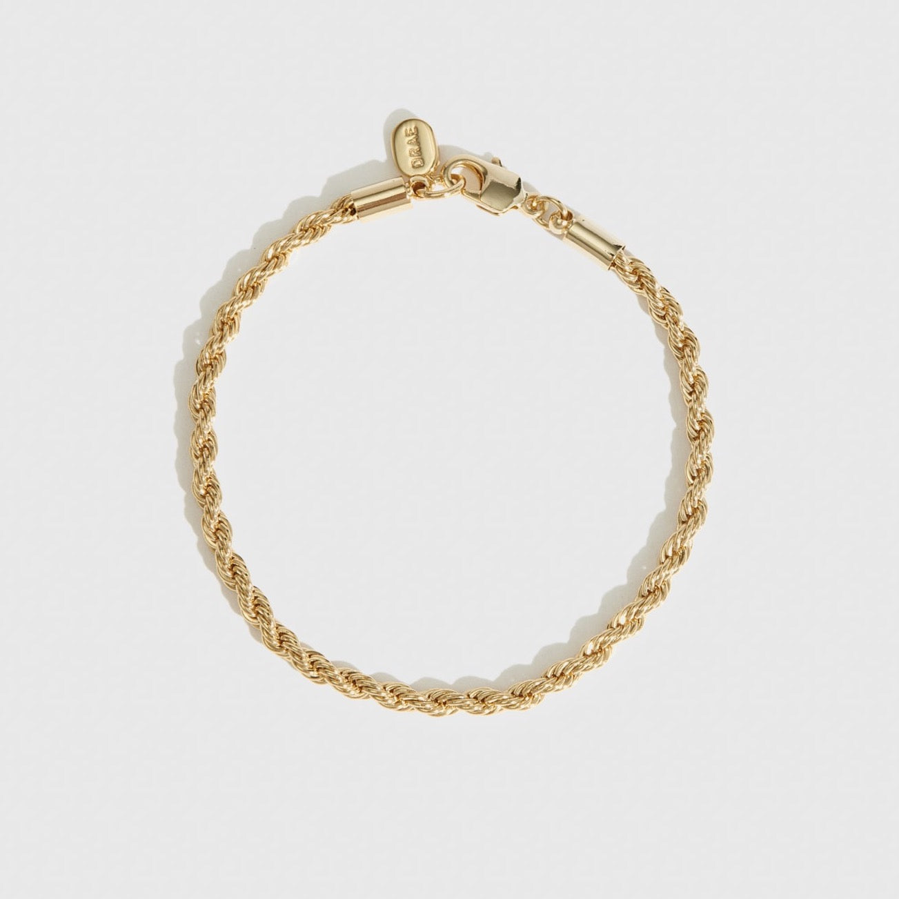 14k gold plated rope bracelet, shown on a plain background.