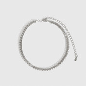 Silver plated thin tennis anklet with cubic zirconia, shown on a plain background.