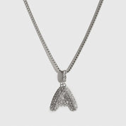 Silver plated pavé bubble letter pendant necklace with cubic zirconia, shown on a plain background.
