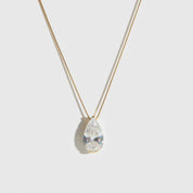 14k gold plated sterling silver 925 solitaire teardrop pendant necklace with a teardrop cubic zirconia, shown on a plain background.