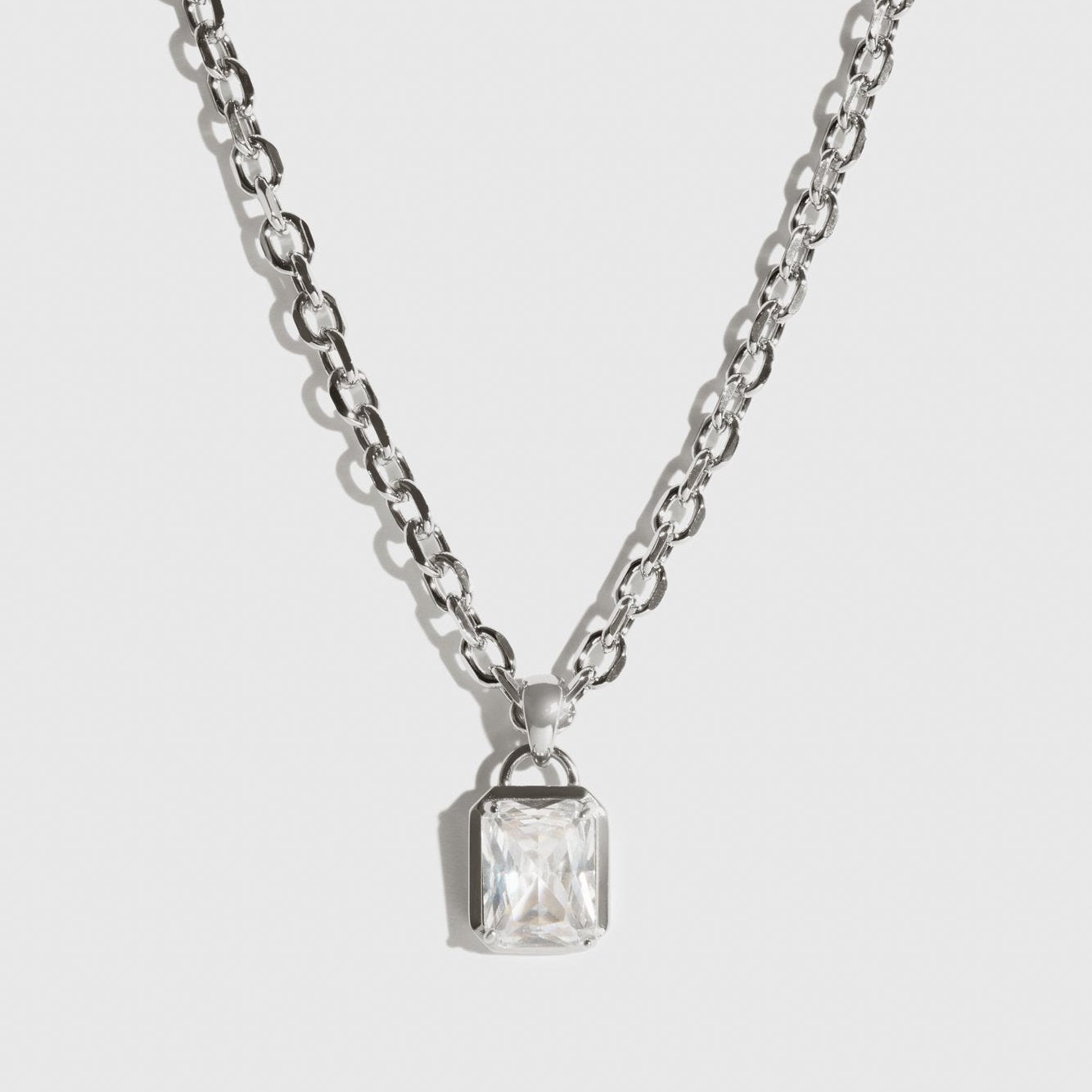 Silver plated baguette necklace with a cubic zirconia, shown on a plain background.