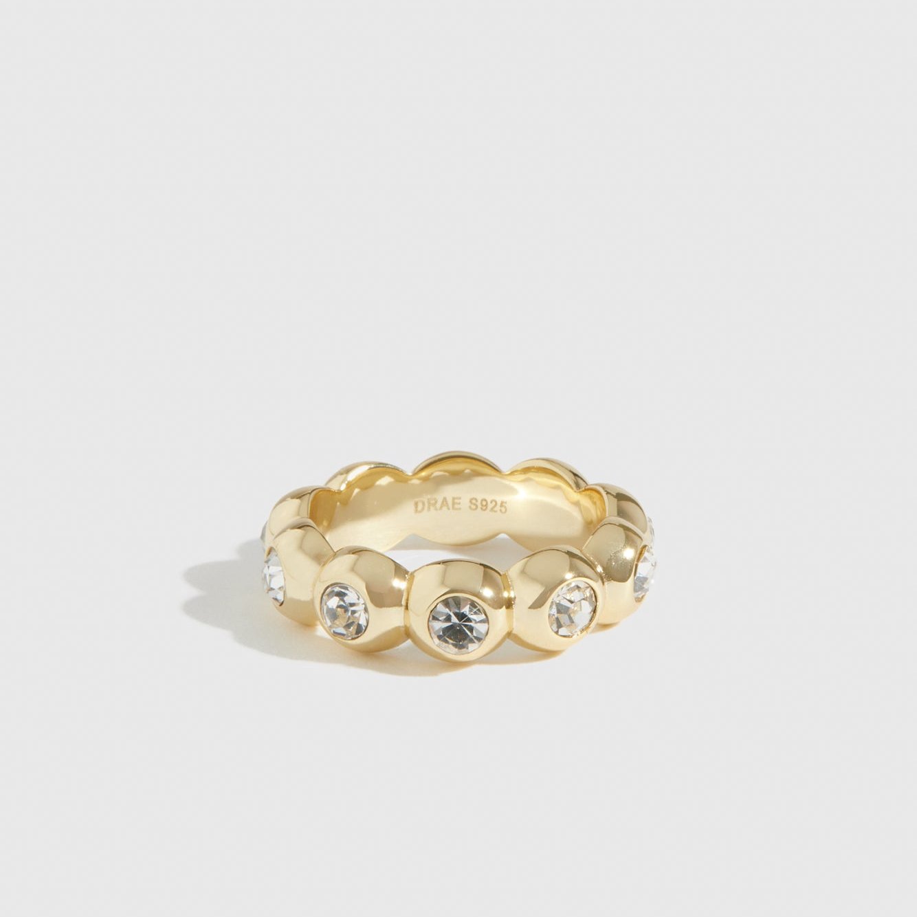 14k gold plated sterling silver 925 puffy pavé ring with cubic zirconia, shown on a plain background.