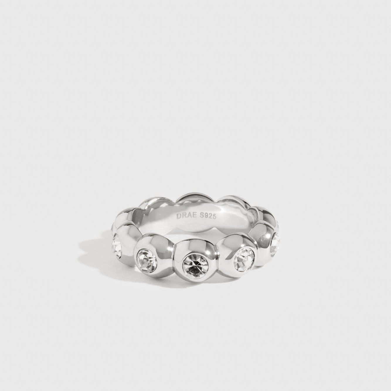 Sterling silver 925 puffy pavé ring with cubic zirconia, shown on a plain background.