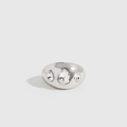 Silver plated teardrops dome ring with teardrop cubic zirconia, shown on a plain background.