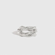 Sterling silver 925 knot pavé ring with cubic zirconia, shown on a plain background.