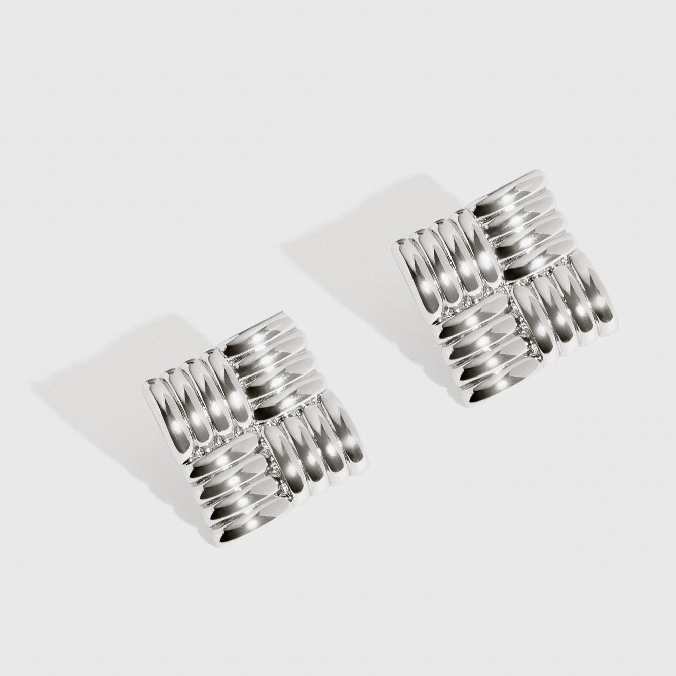 Silver plated retro stud earrings, shown on a plain background.