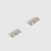 14k gold plated sterling silver 925 ear bar stud with three cubic zirconia, shown on a plain background.