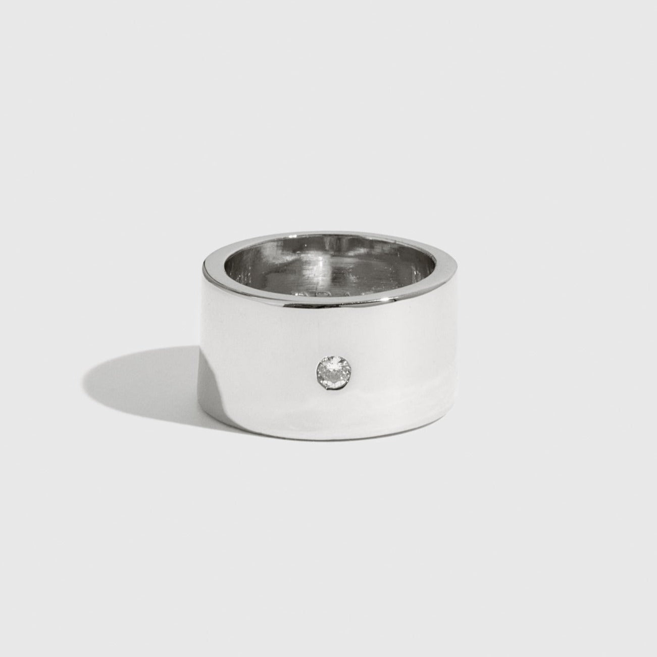 Sterling silver 925 solitaire cigar band with a round cubic zirconia, shown on a plain background.