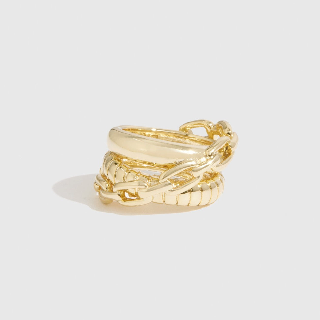 14k gold plated triplet ring, shown on a plain background.