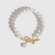 14k gold plated sterling silver 925 Renaissance pearls bracelet with pearls, shown on a plain background.