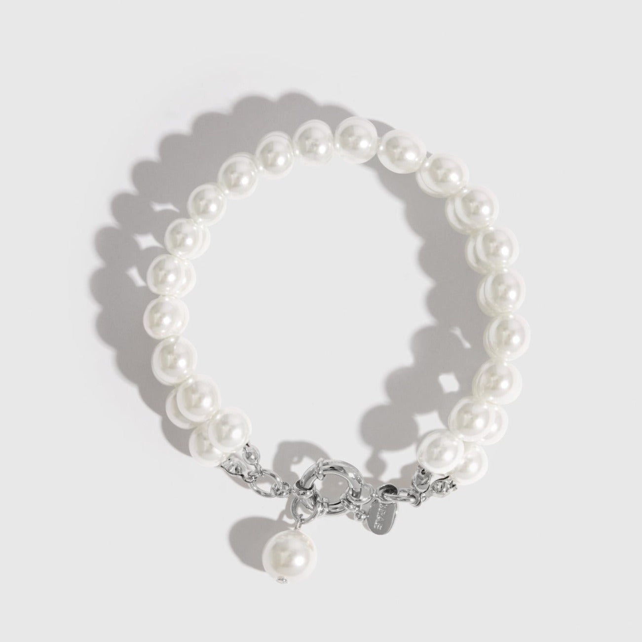 Silver plated Renaissance pearls bracelet with pearls, shown on a plain background.
