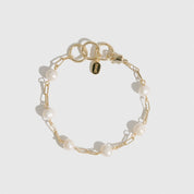 14k gold plated sterling silver 925 paper clips and pearls bracelet with freshwater pearls, shown on a plain background.