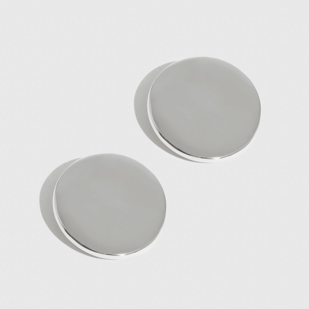 Silver plated full circle stud earrings, shown on a plain background.