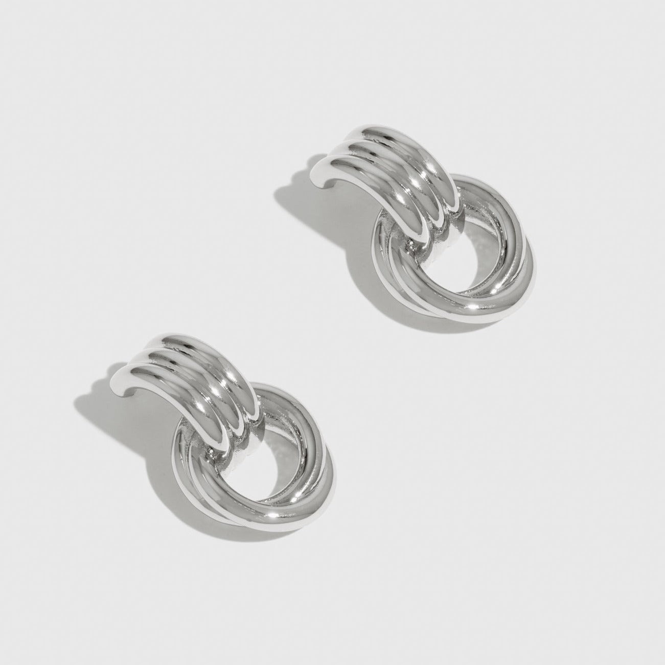 Silver plated twist stud earrings, shown on a plain background.