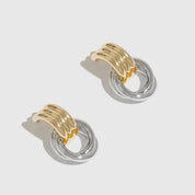 Mixed metal twist stud earrings, shown on a plain background.