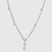Sterling silver 925 paper clips and pearls necklace with freshwater pearls, shown on a plain background.