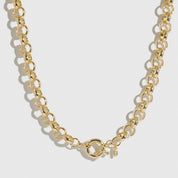 14k gold plated maximalist rolo necklace, shown on a plain background.