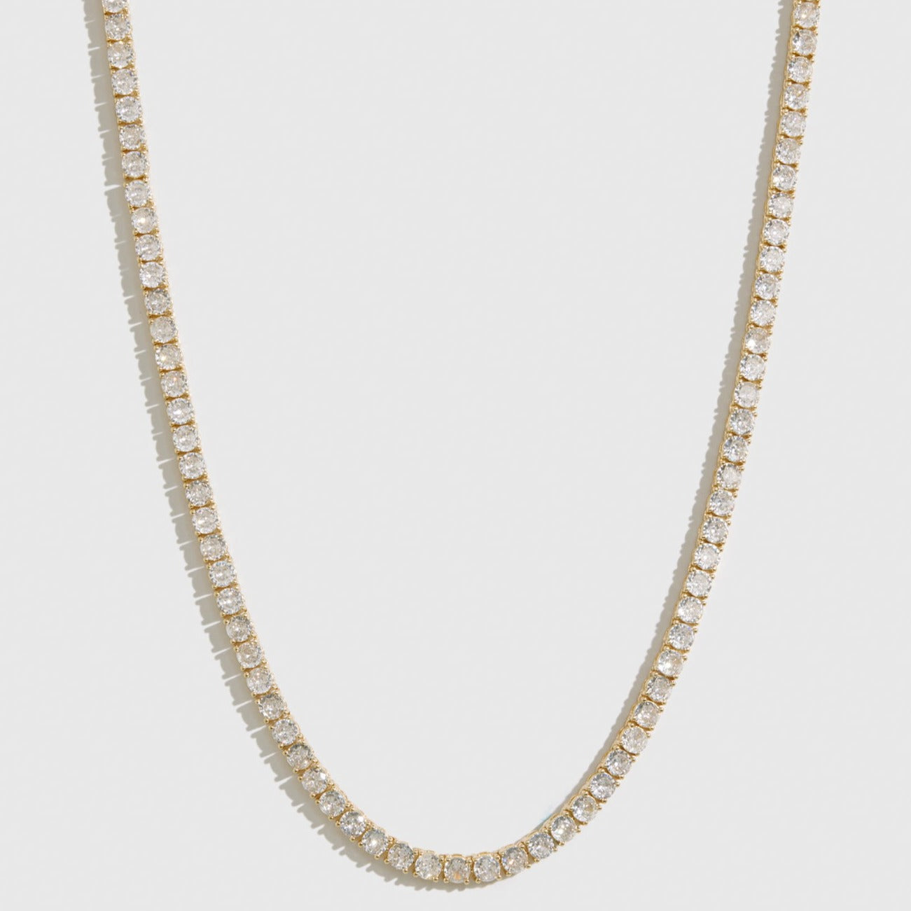 14k gold plated Hidden Hills necklace with round cubic zirconia, shown on a plain background.